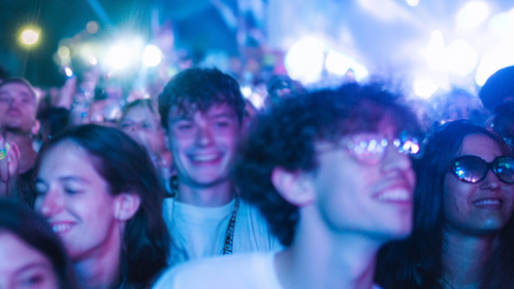 Crowd at a brightly lit dance event