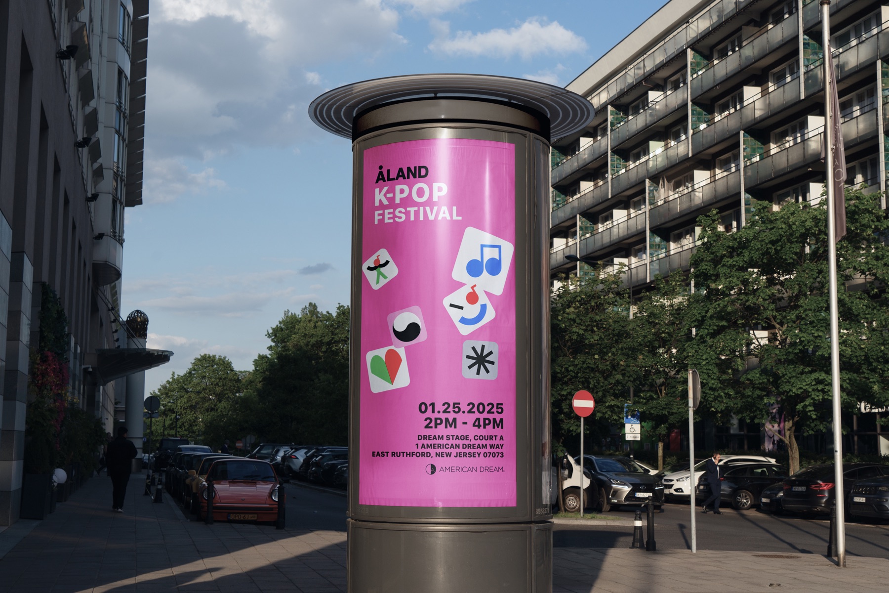 Pink ALAND K-pop Festival artwork applied to a cylindrical street billboard